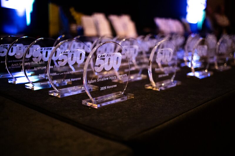 A row of 2026 Law Firm 500 honoree awards lined up before the ceremony